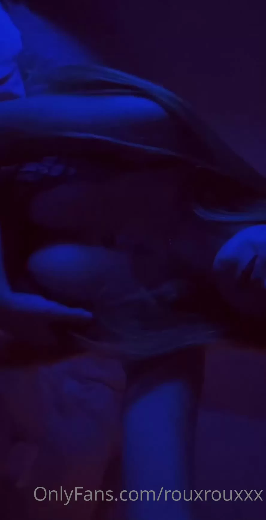 Blonde in Black Lace Lingerie Lying on Bed with Blue Lighting