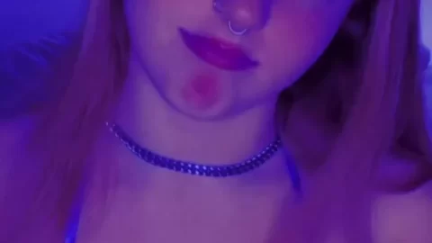 Stunning Blonde with Pierced Nose and Red Lipstick in Bedroom