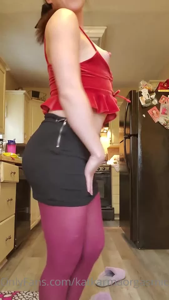 Woman in Red Velvet Top and Maroon Tights Exposes Breasts in Kitchen