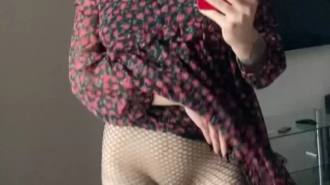 Redhead in Floral Dress and Fishnets Exposes Herself in Mirror