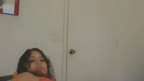 Fit Brunette in Red Crop Top Exposing Breasts on Bed