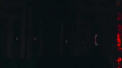 Voluptuous Caucasian Woman with Large Breasts in Red Light Bedroom