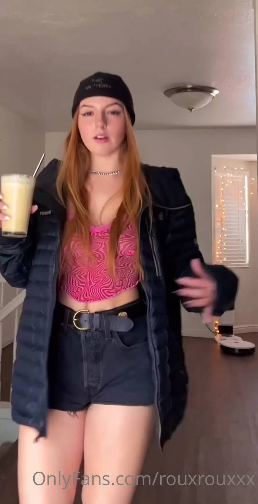 Slim Redhead Dancing and Drinking in Living Room