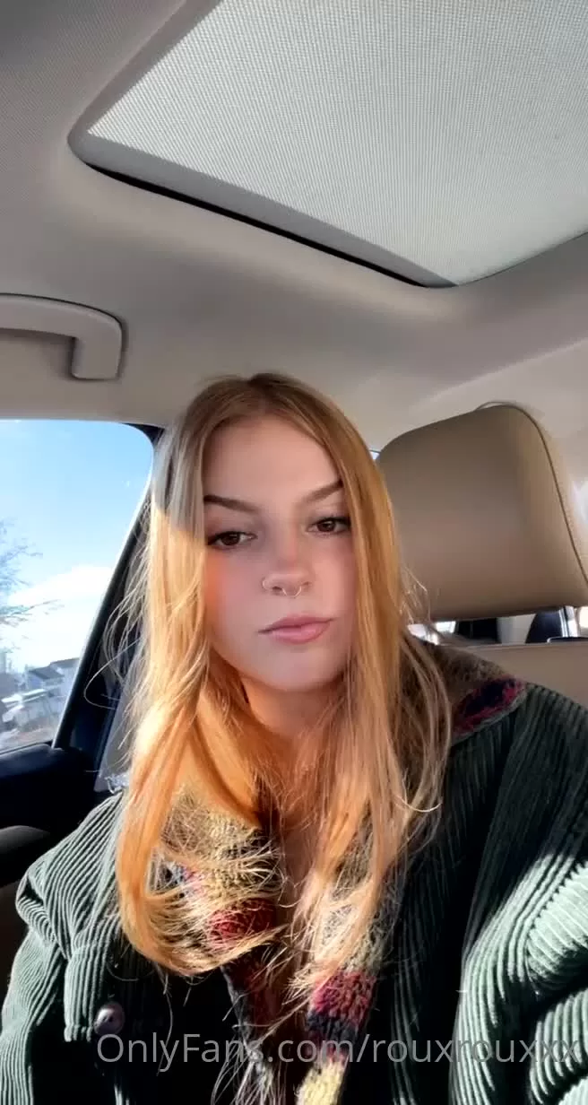 Blonde Woman in Green Corduroy Jacket Inside Car Close-up