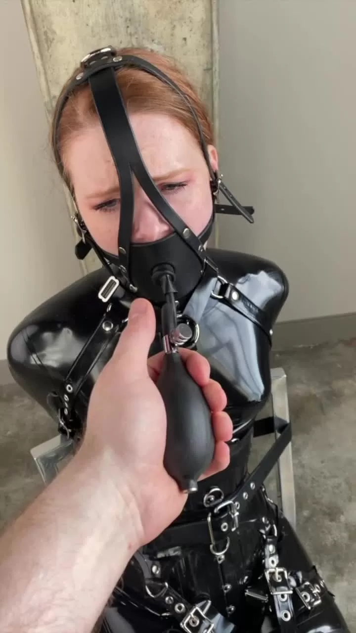 Redhead in Shiny Latex Catsuit Bondage with Inflated Gag