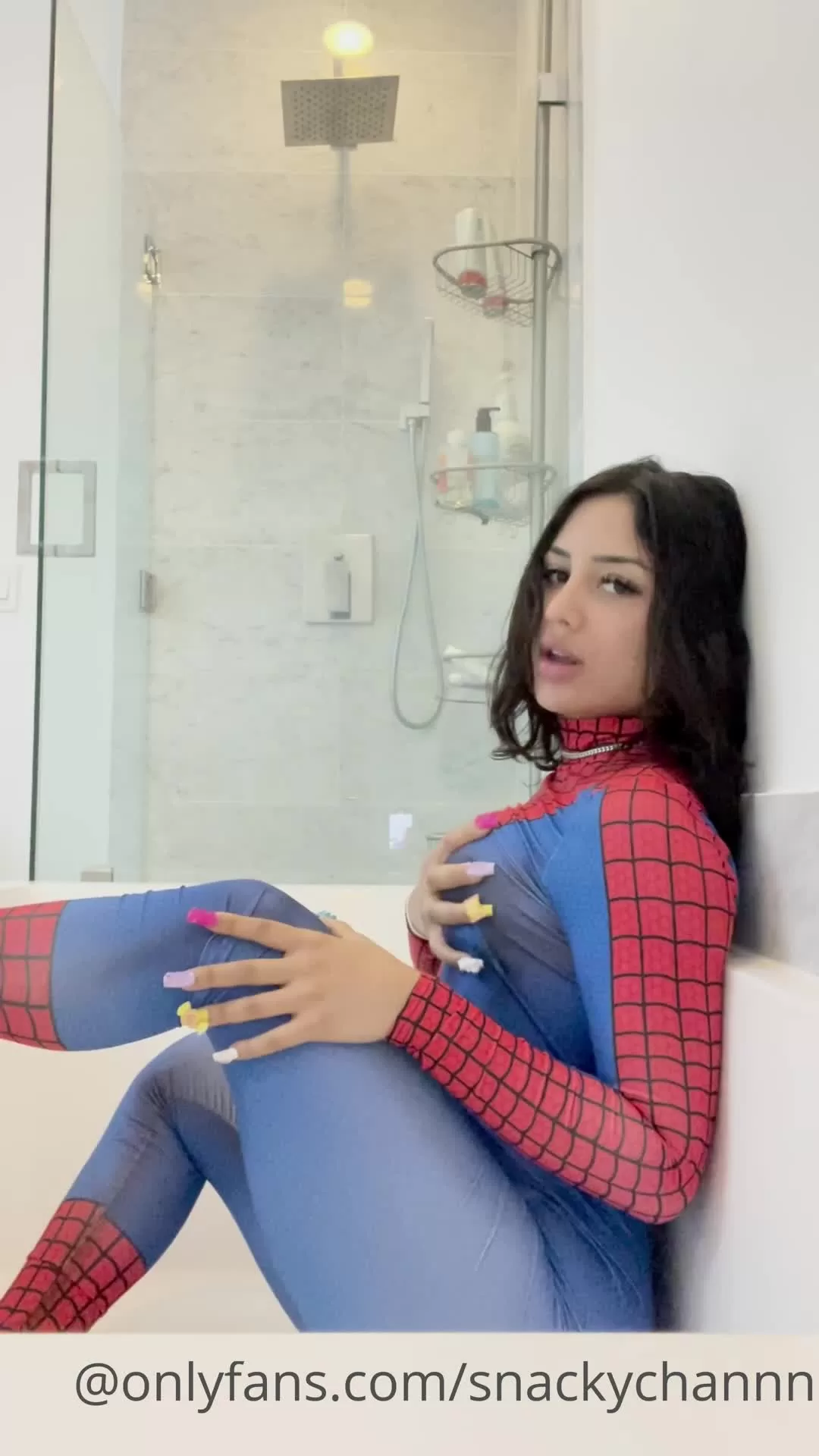 Spiderman Bodysuit Beauty with Long Nails in Bathroom