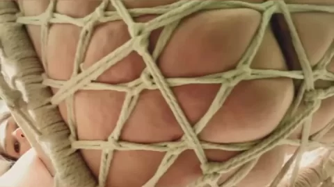 Blonde Woman Nude on Hanging Net Chair POV Close-Up
