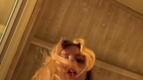 Redhead in White Bikini and Green Gloves Posing in Sunroom POV