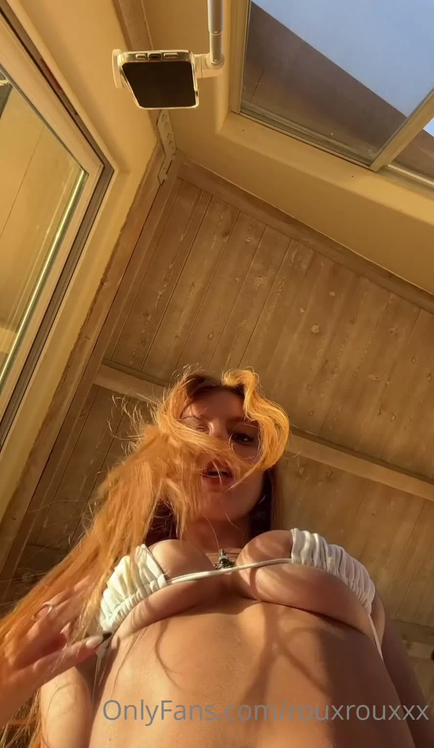 Redhead in White Bikini and Green Gloves Posing in Sunroom POV