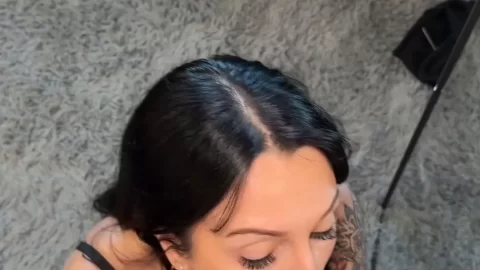 Slim brunette with tattoos gives intense blowjob on bed
