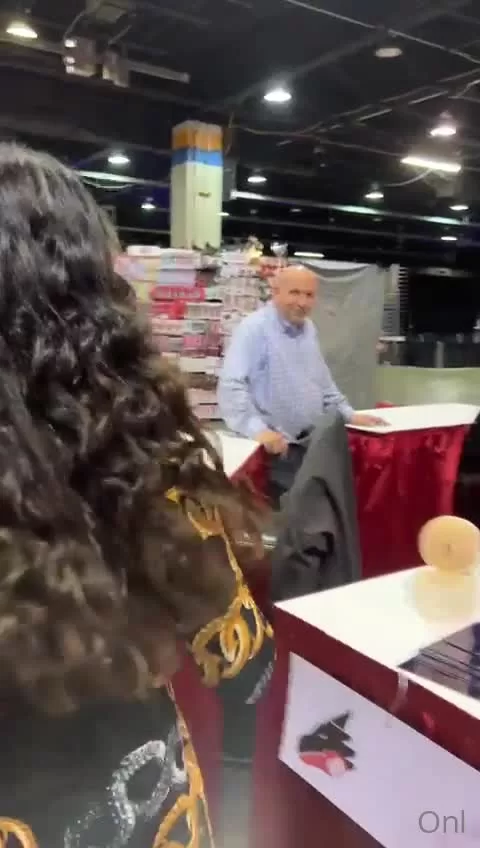 Exxxotica Convention: Curvy MILF Displays Big Cleavage