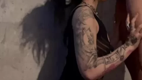Slim Tattooed Brunette Performs Oral Sex Against Concrete Wall