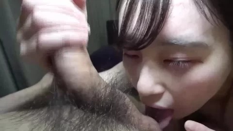 East Asian Woman Straddling Masked Man in Bedroom