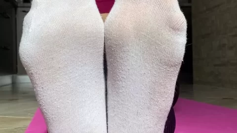 Blonde Yoga Enthusiast Shows Off White Socks and Bare Feet