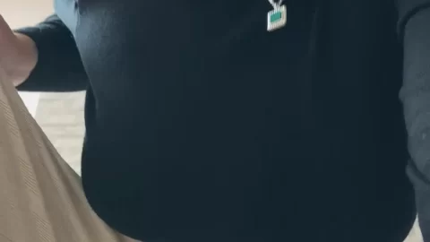 Slim Blonde Woman Showcasing Black High Heels and Wide Leg Trousers