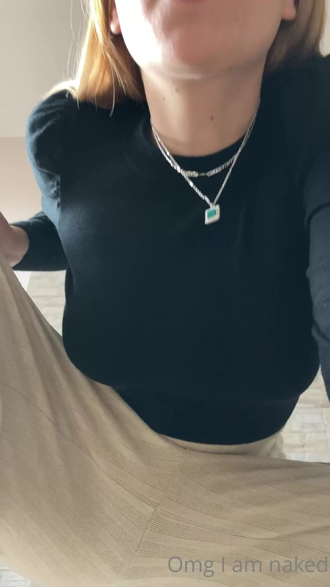 Slim Blonde Woman Showcasing Black High Heels and Wide Leg Trousers