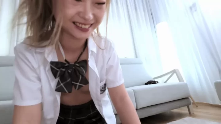 Petite Asian girl jerking off and playing with toys on couch