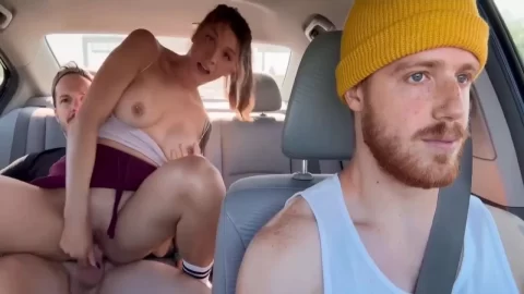 Brunette gets fucked in car by two tatted dudes in daylight