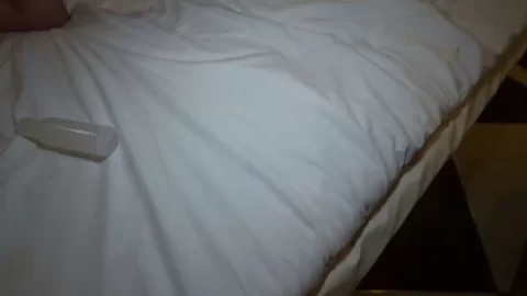 Two Asian girls go at it with vibrator and manual play in dim lit room