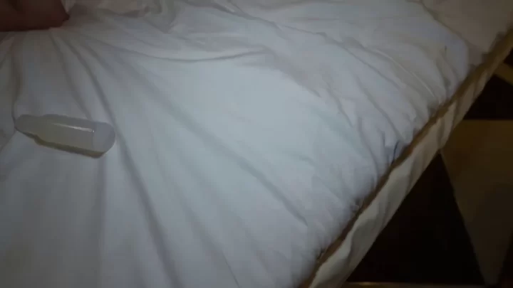 Two Asian girls go at it with vibrator and manual play in dim lit room
