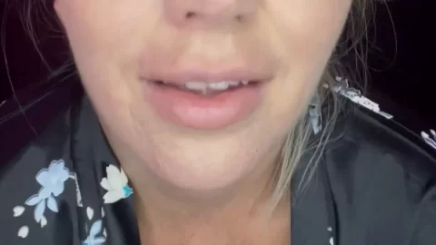 Pregnant blonde MILF shows off big tits and talks to camera in bedroom