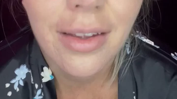 Pregnant blonde MILF shows off big tits and talks to camera in bedroom