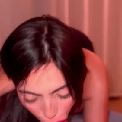Brunette latina gives intense blowjob with black nails in pink-lit roo