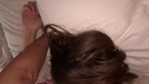 Asian brunette touches herself in bed close-up and personal