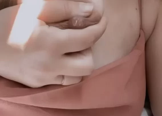 Blonde Girl Exposes Breast in Bedroom