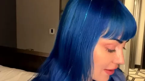 Blue-haired girl poses and touches herself
