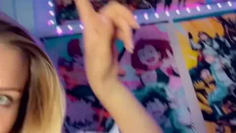 Blonde girl points to poster, gets intimate