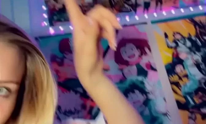 Blonde girl points to poster, gets intimate