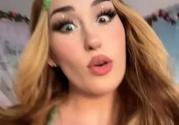 Blonde girl talks dirty, shows cleavage