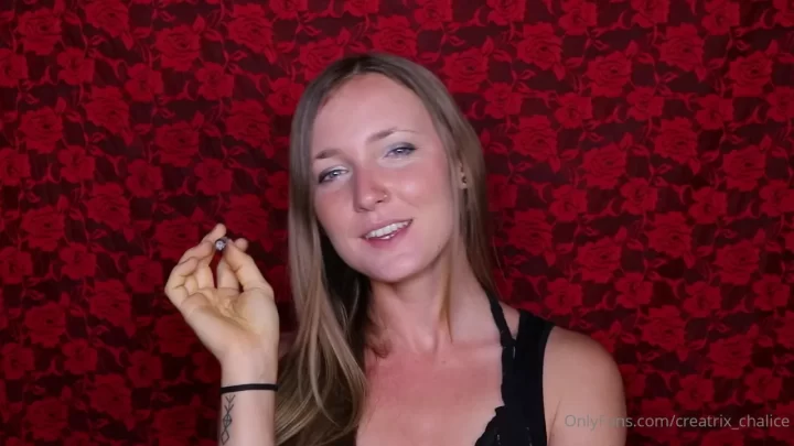 Blonde girl plays with small object