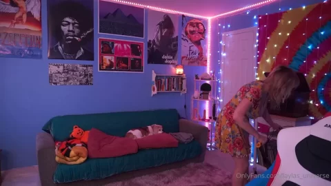 Blonde girl in floral dress fucks herself on couch