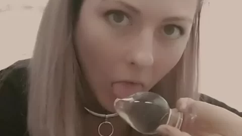 Blonde girl licks butt plug in bathroom