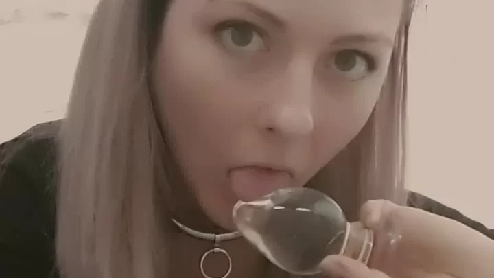 Blonde girl licks butt plug in bathroom