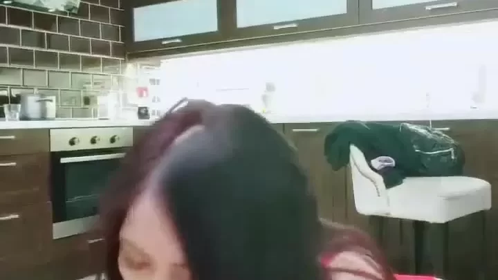 Asian girl gets intimate in kitchen