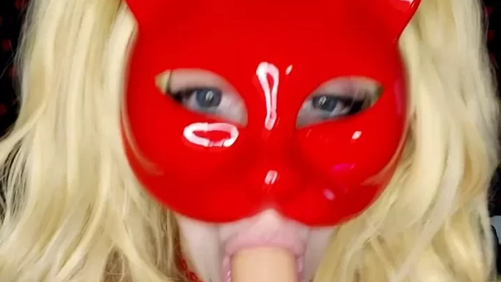 Blonde in red lingerie and cat mask plays with dildo