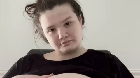 Brunette girl plays with her tits