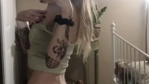 Blonde girl takes selfie in underwear, bending over