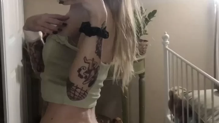Blonde girl takes selfie in underwear, bending over
