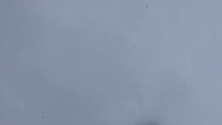 Slim girl walks barefoot in snow