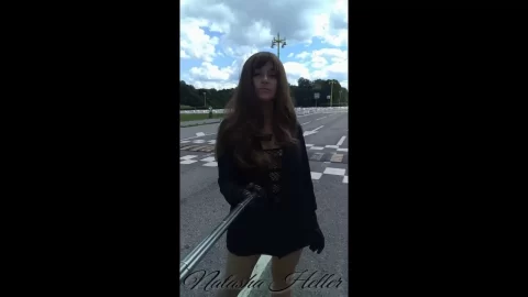 girl in a transparent dress walks near the moscow university part
