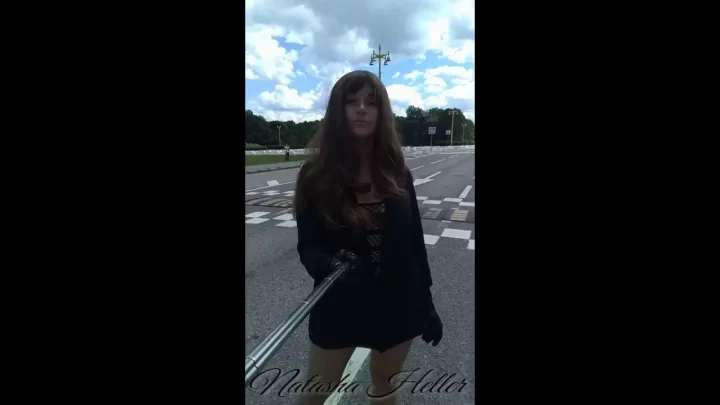 girl in a transparent dress walks near the moscow university part