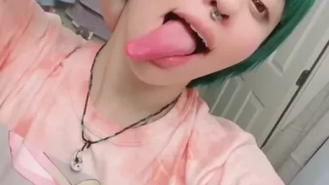 Petite green-haired girl plays with herself