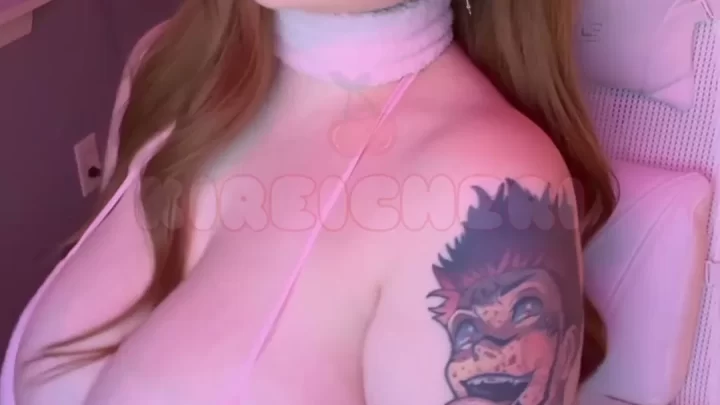Redhead with tattoo and bunny ears fucks herself