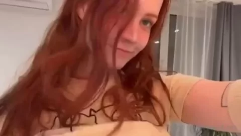 Redhead girl plays with herself