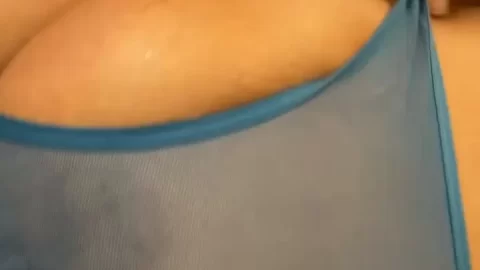 Blonde girl with nipple piercings exposes breasts in bathroom