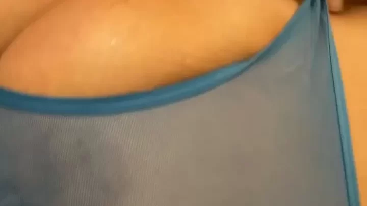 Blonde girl with nipple piercings exposes breasts in bathroom